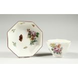 A CHELSEA OCTANGONAL TEABOWL AND SAUCER, painted with flowers and insects, red anchor mark.