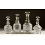 A PAIR OF CIRCULAR HOBNAIL CUT DECANTER AND STOPPERS. 7ins high, and two other DECANTERS (4).