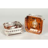 A PAIR OF PLATE AND FAUX TORTOISE SHELL SQUARE WINE COASTERS