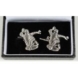A PAIR OF SILVER MICHELIN MAN CUFF LINKS.