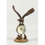 A BRONZE EAGLE BALL CLOCK 8ins high.