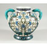 A POTTERY TWIN HANDLED BOULBOUS VASE, in the William de Morgan Isnik style, decorated with