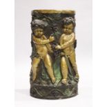 A GOOD TWO COLOUR BRONZE CIRCULAR STAND with Bacchanalian cherubs, square marble top. 2ft 6ins