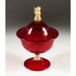 A SALVIATI RED JUG AND COVER with gilt seahorse handles 10ins high.