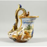 AN ITALIAN MAJOLICA EWER painted with classical scenes