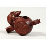 A JAPANESE CARVED WOOD TWO HANDLED VESSEL with a rat. 3.5ins long.