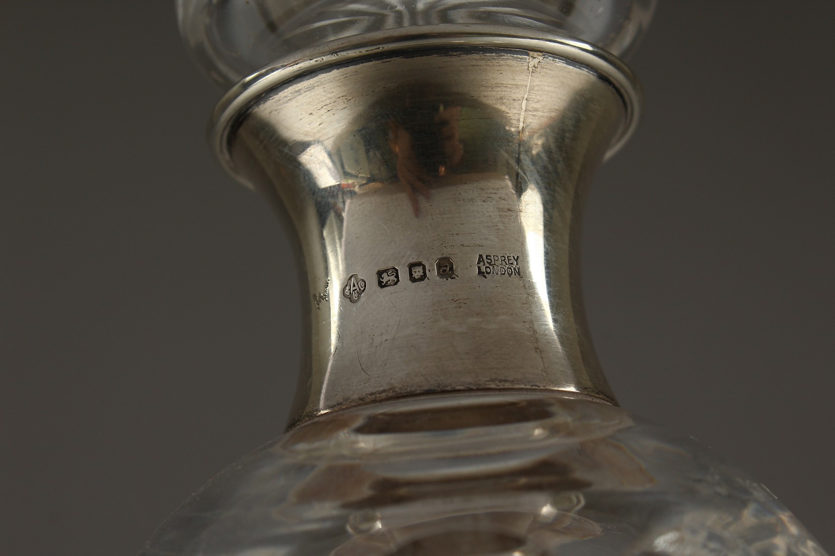 AN ASPREY CUT GLASS DECANTER AND STOPPER with silver band. - Image 2 of 5