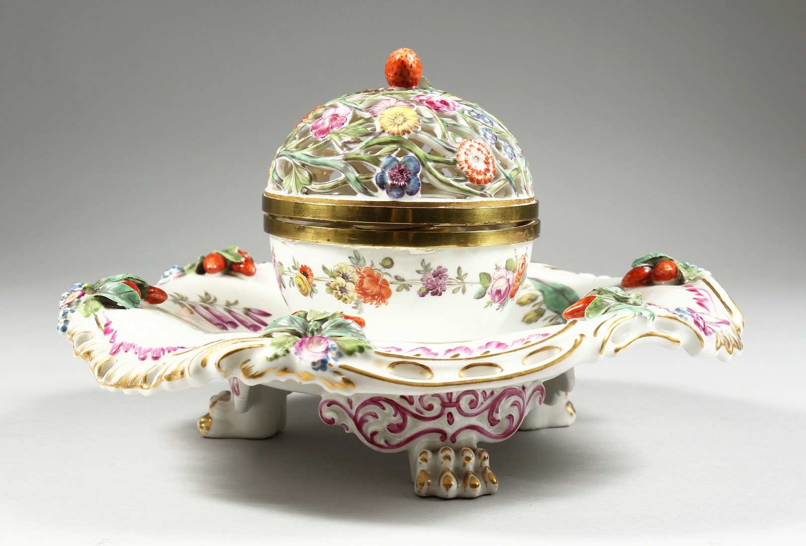 A GOOD 19TH CENTURY CONTINENTAL PORCELAIN CIRCULAR INKSTAND with pierced floral top, painted with