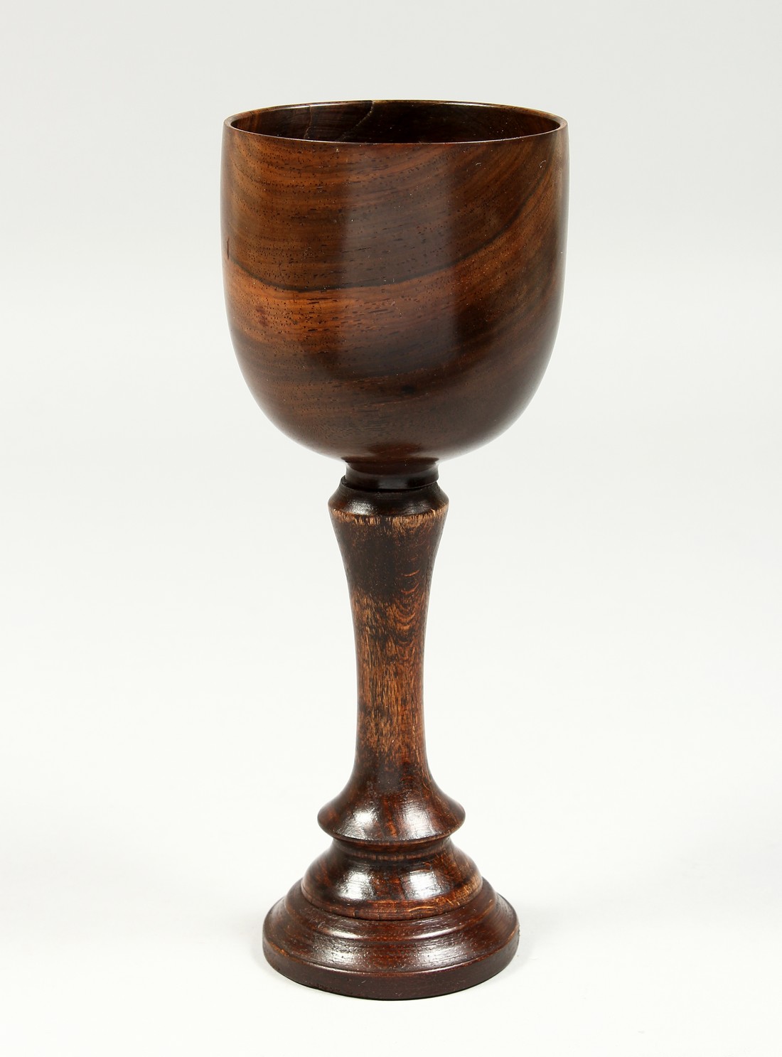 A GOOD TURNED WOOD GOBLET 11.5ins high