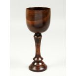 A GOOD TURNED WOOD GOBLET 11.5ins high