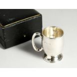 A PLAIN CHRISTENING MUG. Birmingham 1914, in a fitted case.