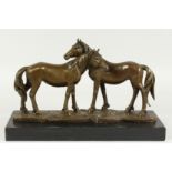 MILO - A GOOD BRONZE OF TWO HORSES on a marble base. Signed, 15ins long.