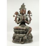 A LARGE CHINESE BRONZE SEATED GOD Signed, 26ins high.