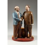 A RUSSIAN PORCELAIN GROUP OF LENIN AND A CHINESE GENERAL holding a pipe, possibly General Wei