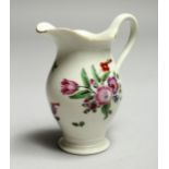 A WORCESTER FAMILLE ROSE JUG, painted with flowers. 3.5ins high.