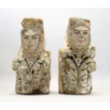 A PAIR OF MEDIEVAL CARVED SANDSTONE CORBELS, each carved with female faces, one with a column