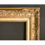 An early 20th century carved wood frame, rebate size 16" x 30", 40.5 x 76 cm.