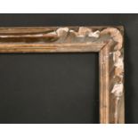 A carved wood frame, 10.5" x 16", 17 x 41 cm.