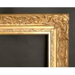 A gilt composition frame, wide rebate 23" x 39.5", 58 x 100 cm, would fit 24" x 40", 61 x 102 cm.