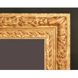 A gilt composition frame with trailing foliage, rebate size, 14.25" x 21.5", 36 x 55cm.