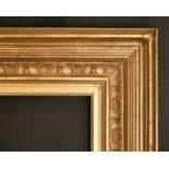 A shaped and composition gilt frame, 33.25" x 52.25", 84.5 x132.75 cm to slip, 34.75" x 54", 88.25 x