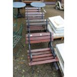 A set of four wooden and cast metal garden seats.
