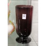 An amethyst coloured pedestal vase with bubble decoration.