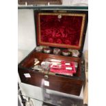 A ladies' Victorian rosewood vanity case with various contents.