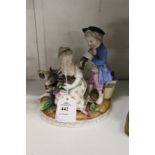 A 19th century Meissen style porcelain group of a boy and girl.