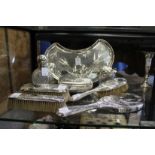 A very good Sheffield silver eight piece dressing table set, comprising crescent shaped tray, cut