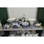 A shelf of blue and white china.