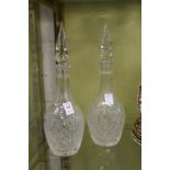 A pair of cut glass decanters.