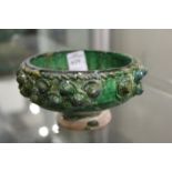 A good Kashan moulded green glazed pottery bowl.