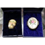 A Halycon Days enamel egg shaped box and an oval box.