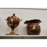 A copper samovar and embossed metal jardiniere.