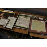 A quantity of framed reproduction maps.