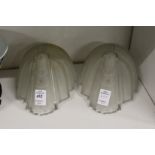 A pair of Art Deco frosted glass shades.