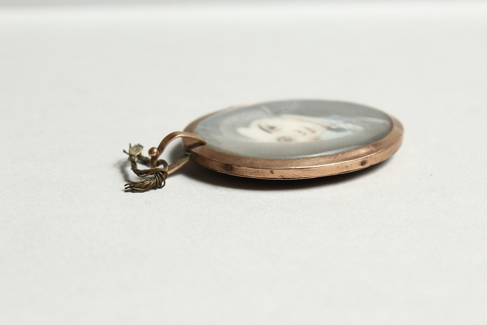 A GEORGIAN OVAL MINIATURE OF A YOUNG MAN, the reverse with plated hair. 1.25ins x1.25ins - Image 5 of 5