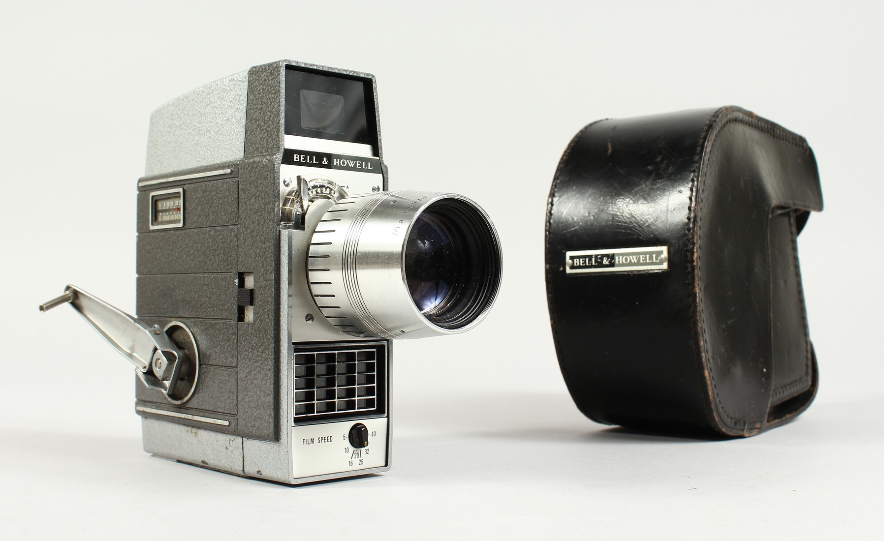 A BELL AND HOWELL LEATHER CASED MOVIE CAMERA