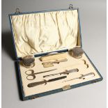 A SILVER MOUNTED MANICURE SET IN BOX. Birmingham 1902