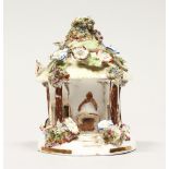 A COALPORT FLOWER ENCRUSTED PASTILLE BURNER. 4ins high.