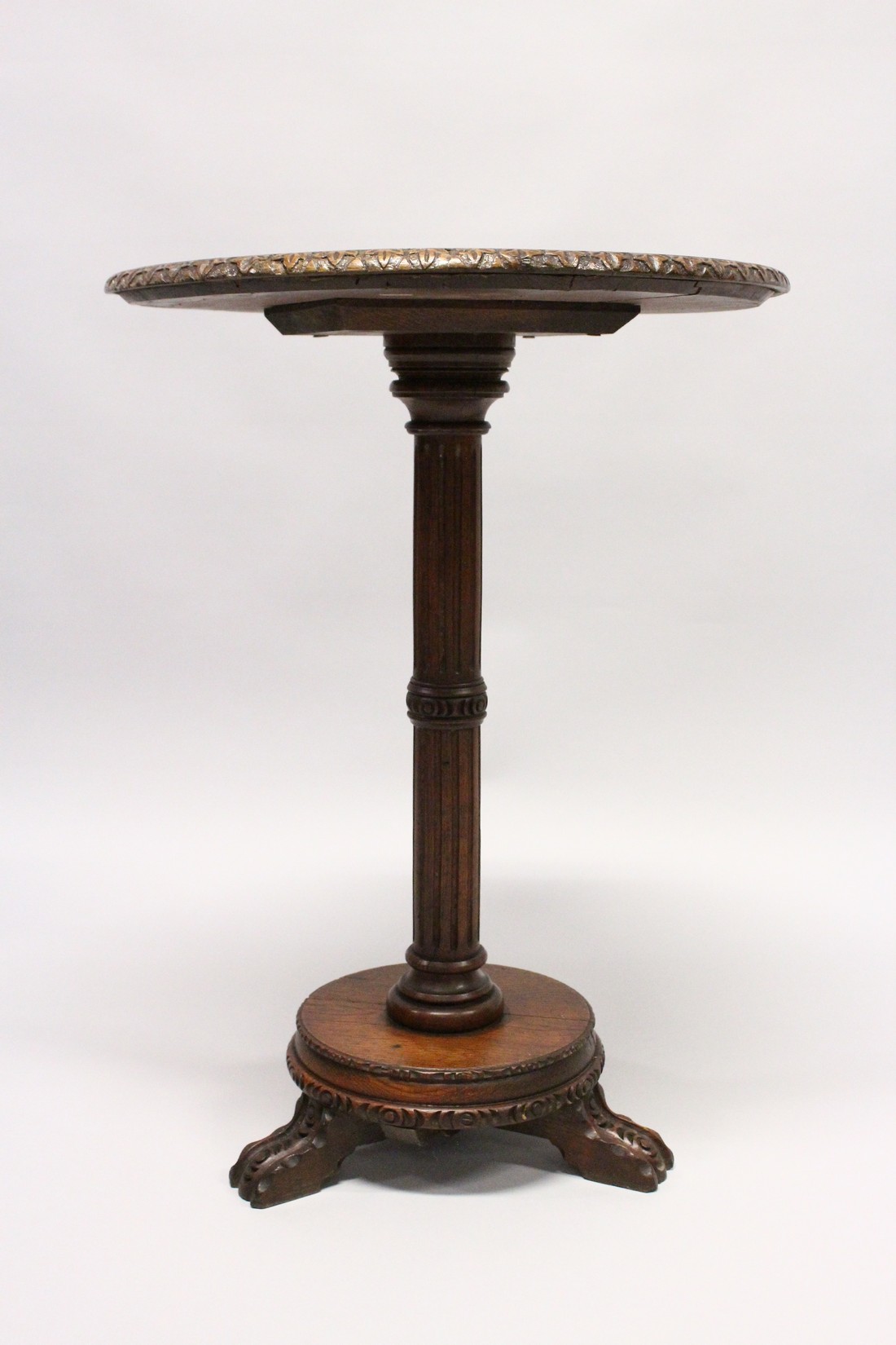 A 19TH CENTURY CIRCULAR TABLE, the star top inlaid with specimen woods on a fluted pillar and - Image 3 of 4