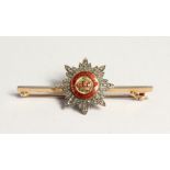 A DIAMOND AND ENAMEL BAR BROOCH 'TRIA JUNTCA UNO'.