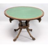 A REGENCY MAHOGANY CIRCULAR TABLE, with inset leather top with four curving rams masks on hoof feet.
