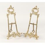 A PAIR OF MEDIUM BRASS EASELS 1ft 4ins high