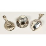 TWO SILVER CADDY SPOONS, JOCKEY CAP AND ACORN.