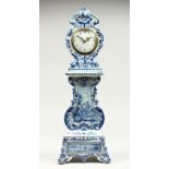 A 19TH CENTURY DUTCH BLUE AND WHITE MINIATURE PORCELAIN LONGCASE CLOCK, the movement by Charles