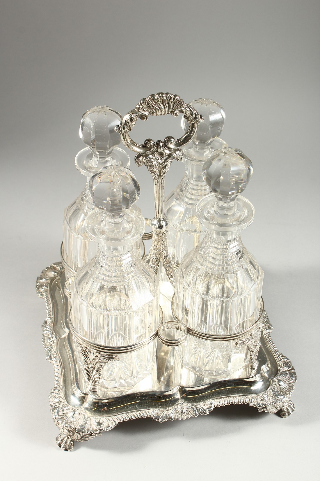 .A GOOD GEORGE III FOUR BOTTLE CRUET filled with four whisky decanters and stoppers. The stand - Image 3 of 9