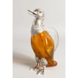 AN AMBER GLASS DUCK CLARET JUG with silver plated mounts, 11ins high.
