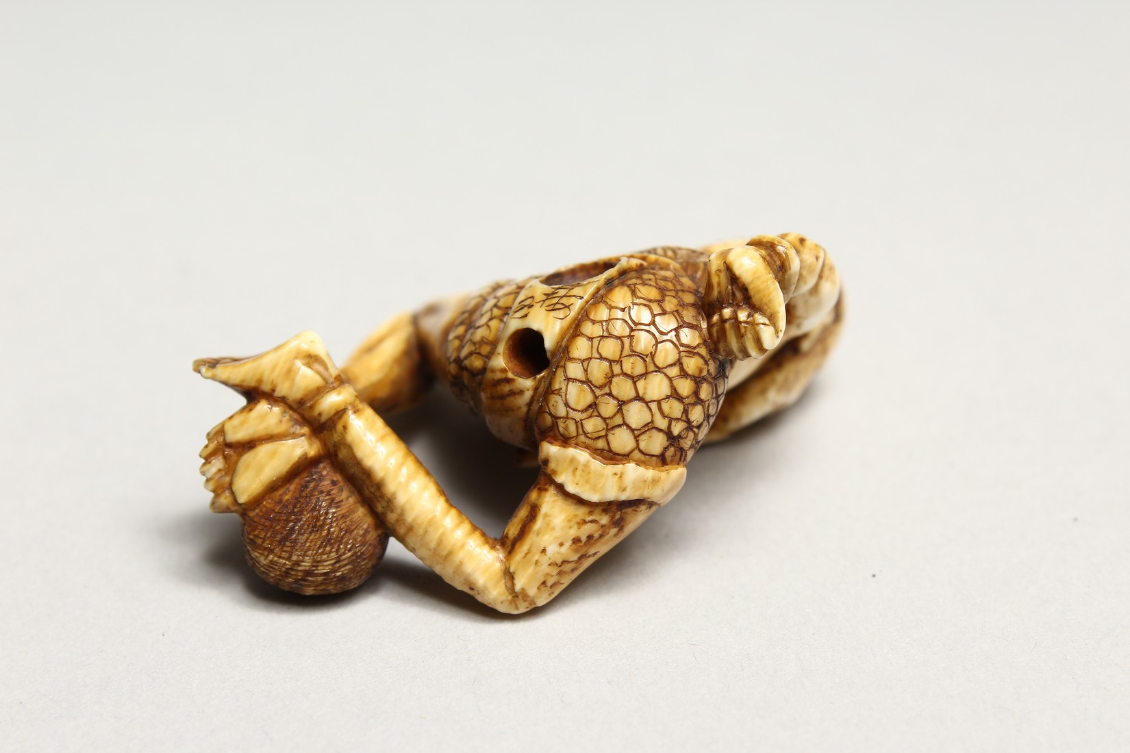 A CARVED BONE NETSUKE OF AN ONI 1.5ins - Image 5 of 6